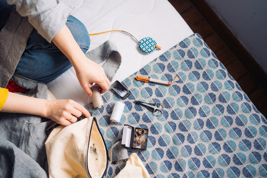 Hands working on a sewing project