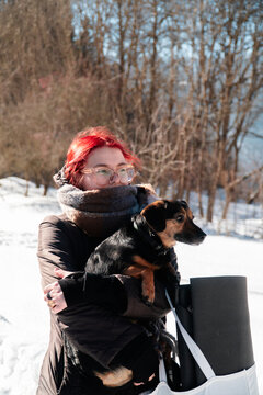 Hugging mutt dog outdoors