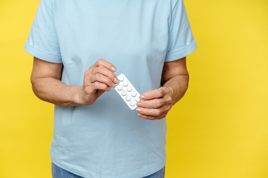 Close-Up of Senior Woman with Blister Pack of Pills