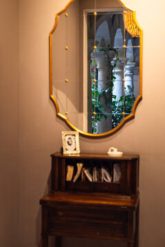 Vintage furniture with golden frame mirror