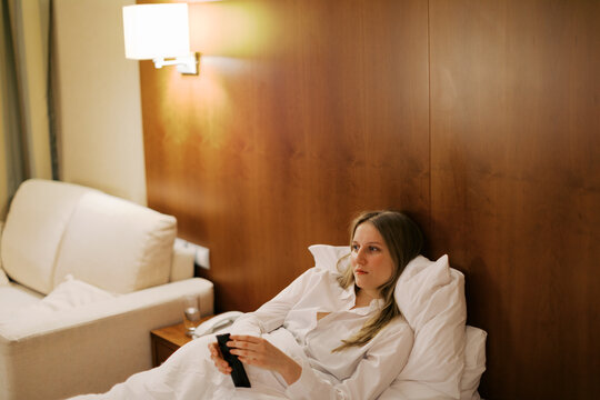  blond young woman on the bed