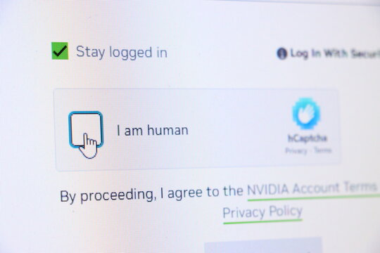 Checkbox selected for stay logged in and I am human text on screen. Captcha and security concept for online authentication.