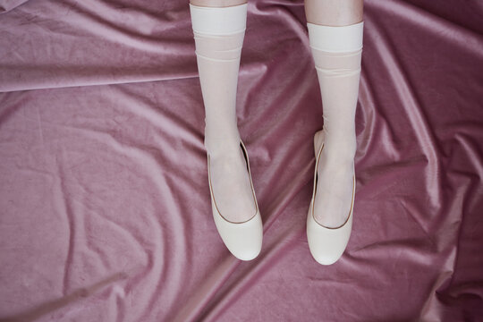 Trendy fashion with woman in white shoes and socks