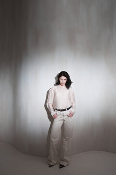 Full body fashion portrait of woman in trendy outfit 