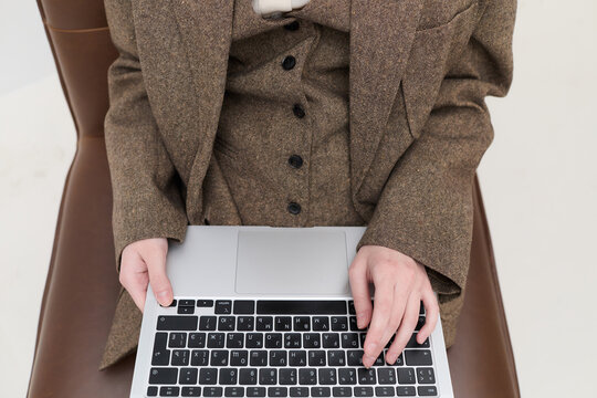 Closeup of Hands Typing on Laptop