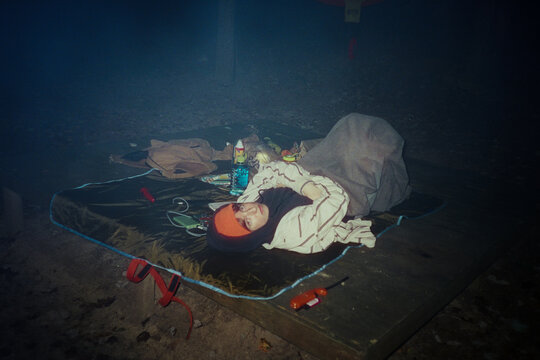 Camper Lying Down Outside at Night