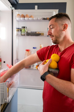 Taking out food from fridge