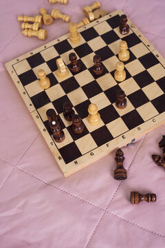 Chess on pink blanket