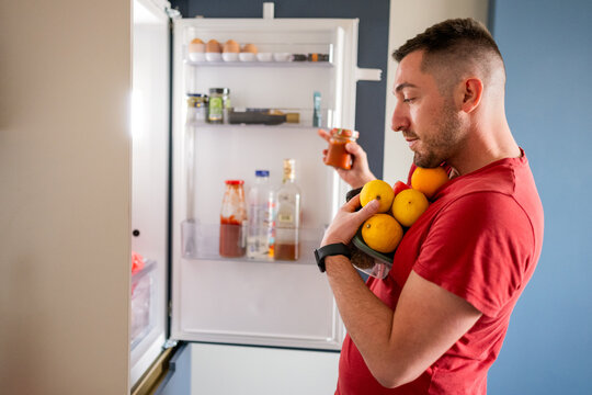 Taking out food from fridge
