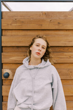 young woman in front of of  locker room at the beach