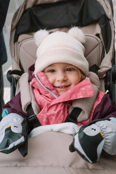Smiling toddler in stroller 