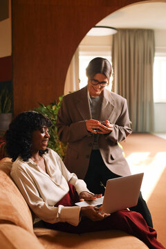 Women teamwork having a business discussion in stylish workspace