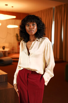 Portrait Professional woman standing in stylish workspace