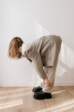 Unrecognizable woman bending forward