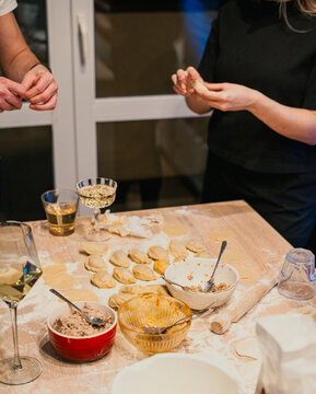 Cooking home party - people making dumplings at home