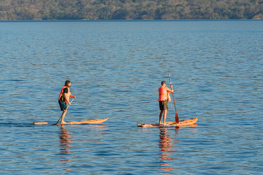 People paddleboarding on a lake
