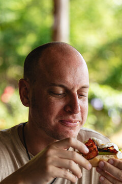 Man enjoying a meal outdoors