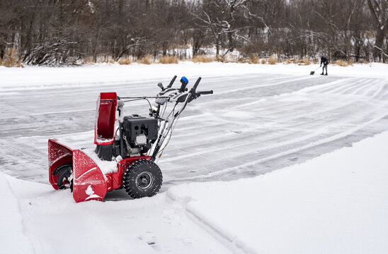 Snowblowing ice rink