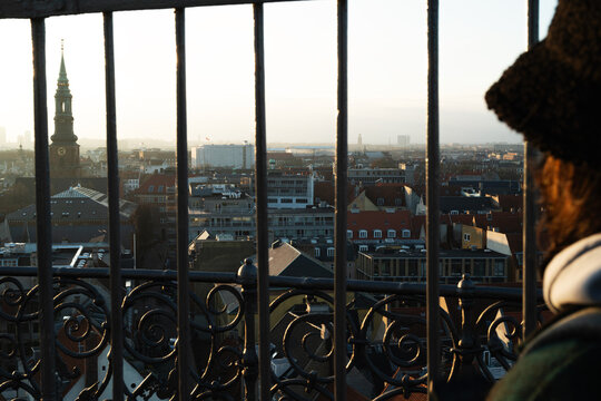 Young man on a watchtower in Kopenhagen 