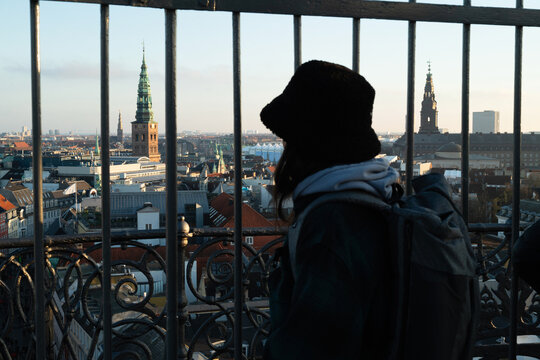 Young man on a watchtower in Kopenhagen 