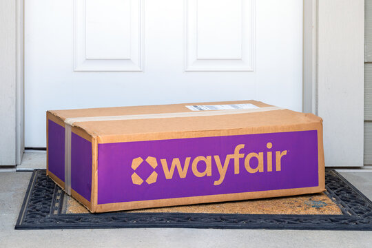 General view of a Wayfair delivery box at the doorway of a residential home. Wayfair Inc. is an American e-commerce company based in Boston, Massachusetts known for it's low prices. August 2 2025.