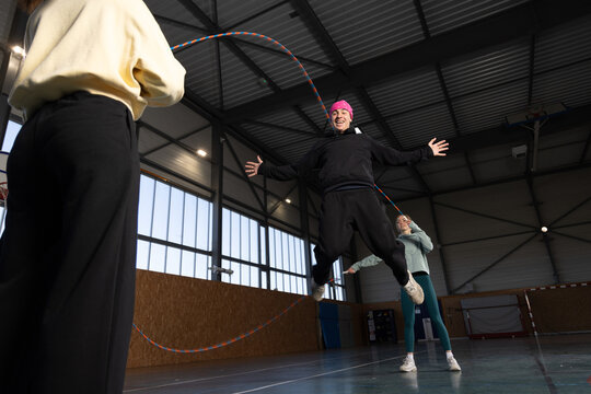 Double Dutch Team Trainning in Dim Lighting Sports Court