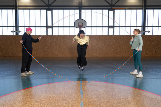 Friends warming up before basketball game 
