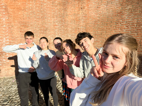 Group photo of students in front of high school building