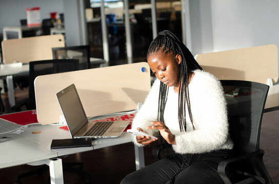 businesswoman in Office on her Phone