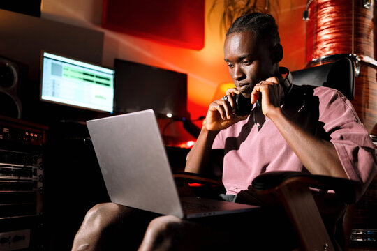 Man Working on Laptop Music Production