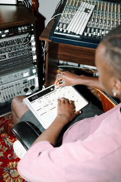 Music producer using drum machine