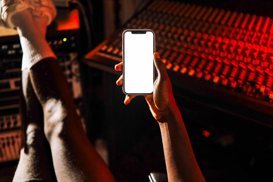 Hand holding mockup phone with blank screen