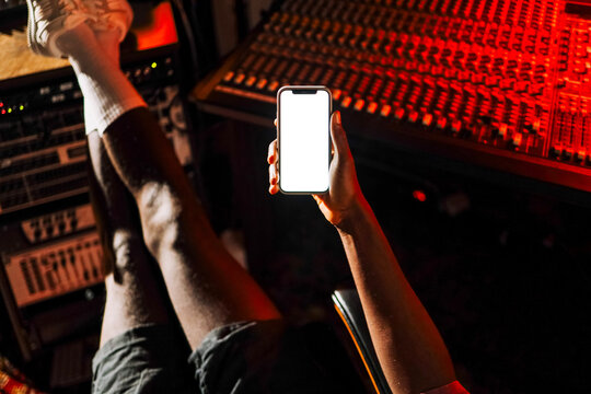 Mockup phone with white screen in recording studio
