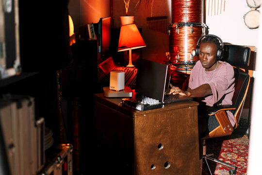 Music Producer Working on Laptop in Studio