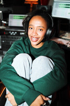 Portrait woman listener enjoying music in recording space