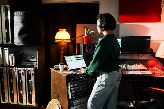 Woman Mixing Audio in Recording Studio