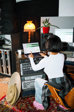 Woman Music Producer Editing Audio Tracks