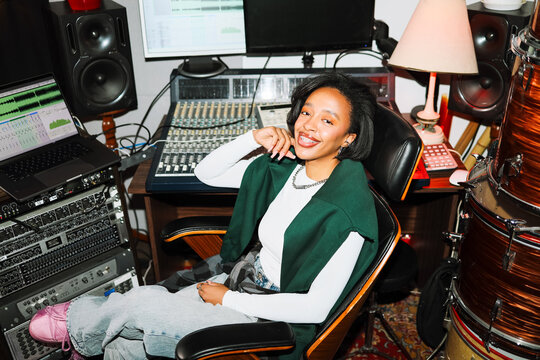 Happy Woman Sound Engineer in Creative Space