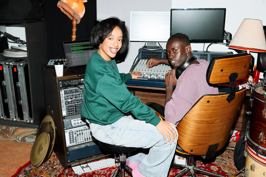 Creative Man and Woman Mixing Tracks with flash 