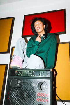 Stylish musician posing in a recording studio
