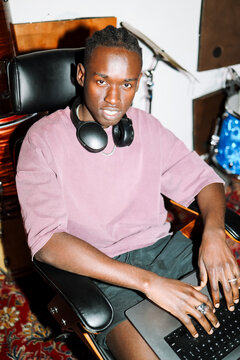Portrait Man Working on Laptop in Music Studio