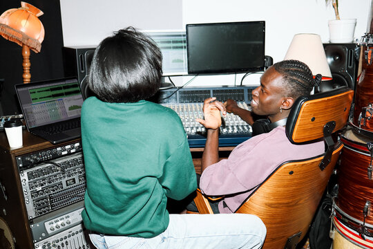 Music Producers Collaborating in a Studio
