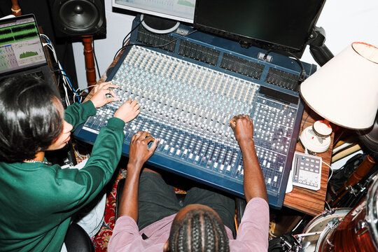 Creative Duo Working in a Recording Studio