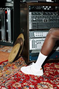 Man&rsquo;s Foot Resting Near Audio Equipment