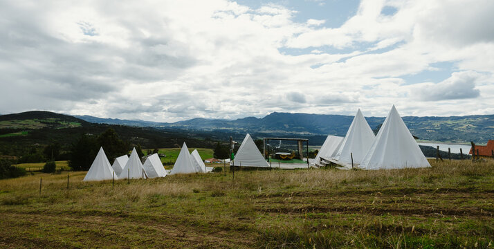 White teepee tents glamping in the colombian countryside 