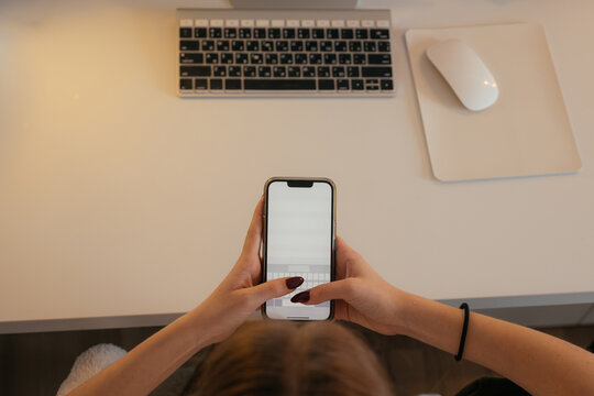 Using a smartphone at a workspace with a keyboard and mouse
