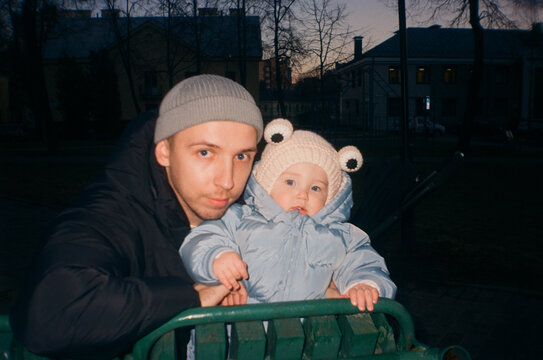 Father and Baby Winter Portrait. Film Flash Photo