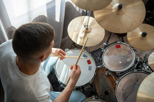 Overhead view of drummer with drumsticks