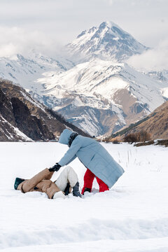 Sisters play in snow together