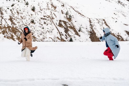 Active Sisters play in snow